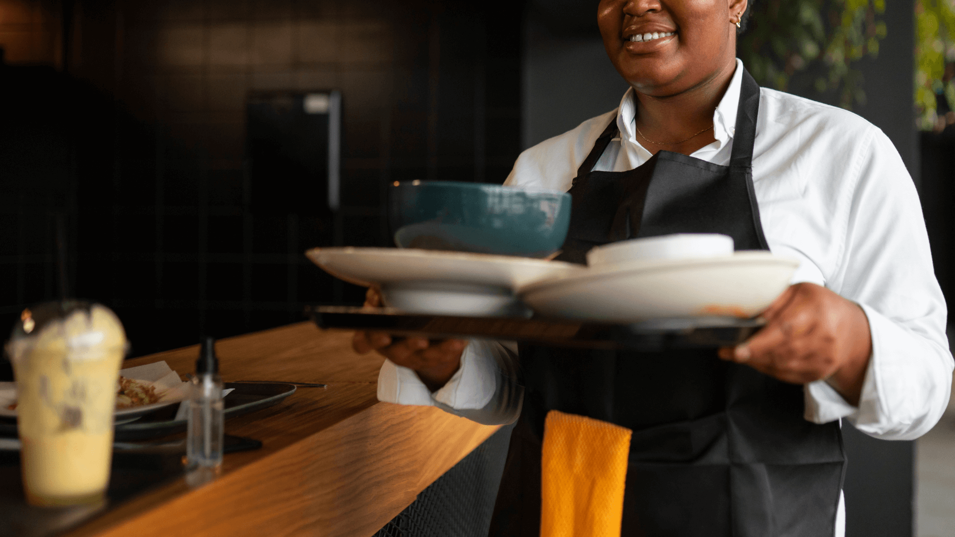Waitress holding plates