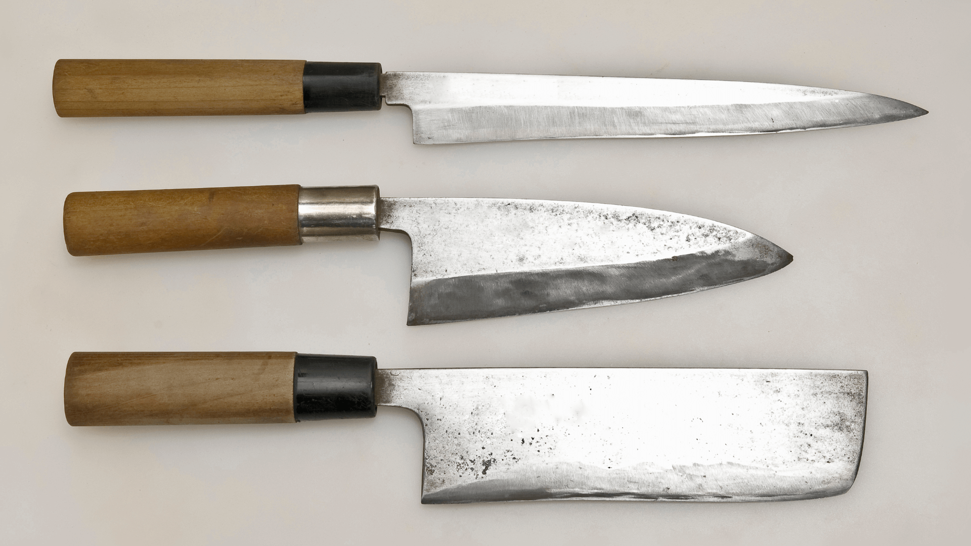 Three knives with wooden handles